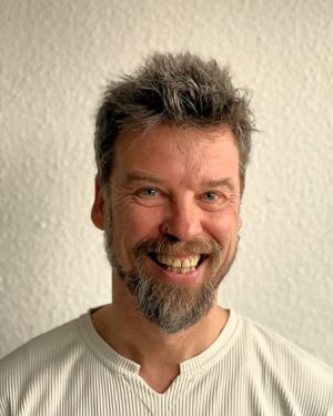 Ein Portraetfoto von Oliver Schneider